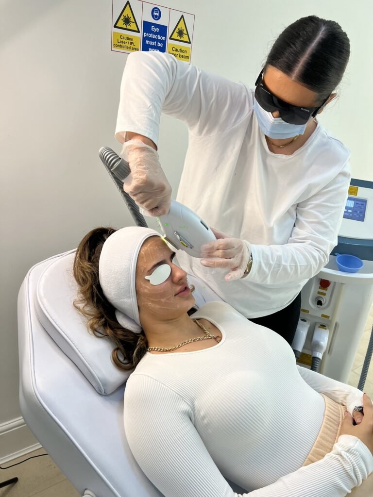 Student performing IPL treatment during hands-on training at Skintastic Aesthetics