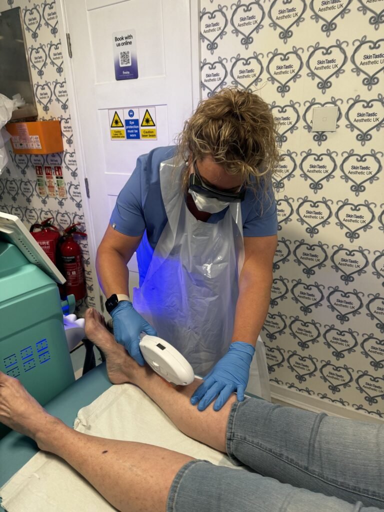 Student practising laser hair removal on the leg during training