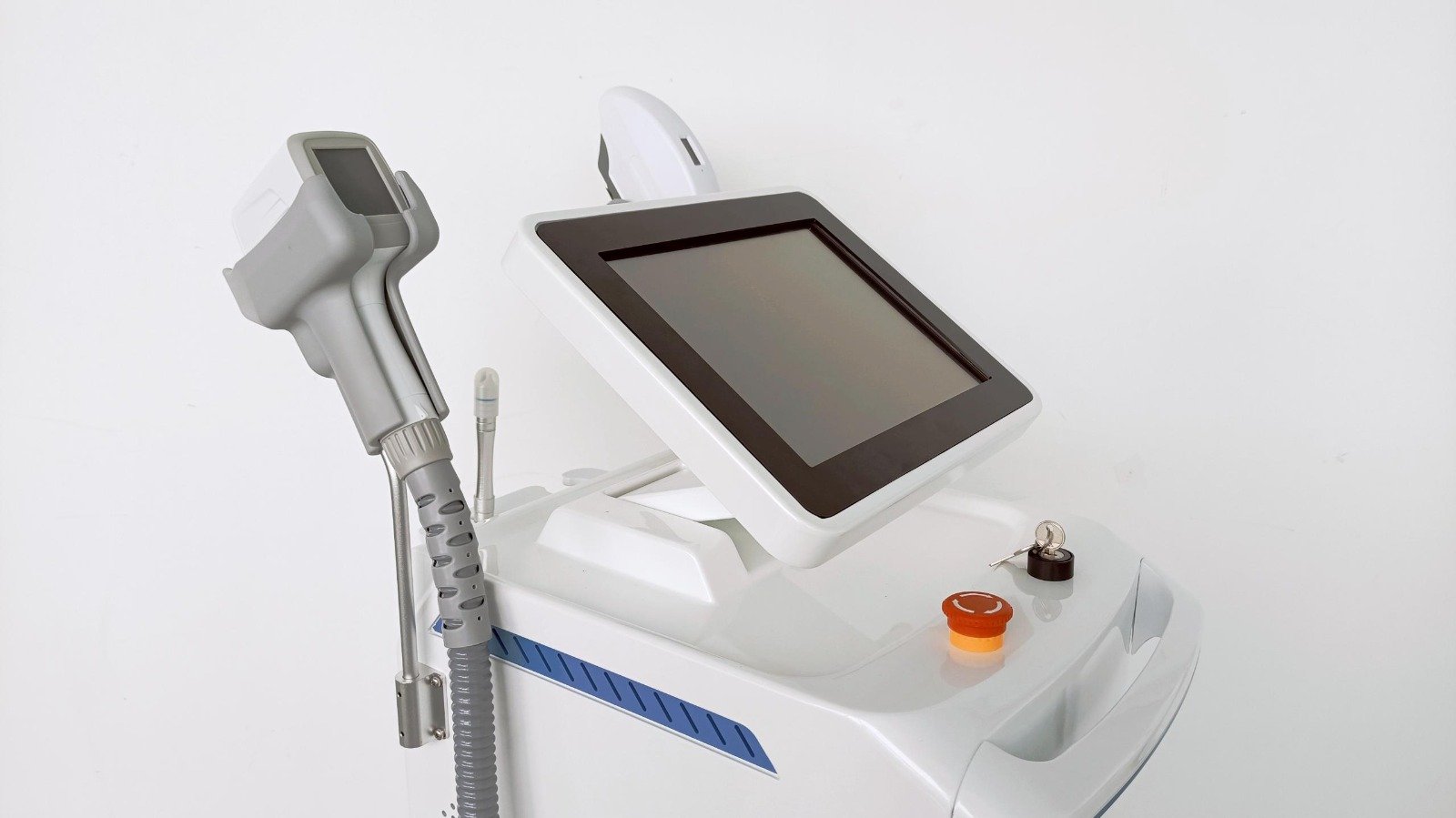 Close-up of the ADPL-2 touchscreen, key switch, emergency stop and handpiece cradle