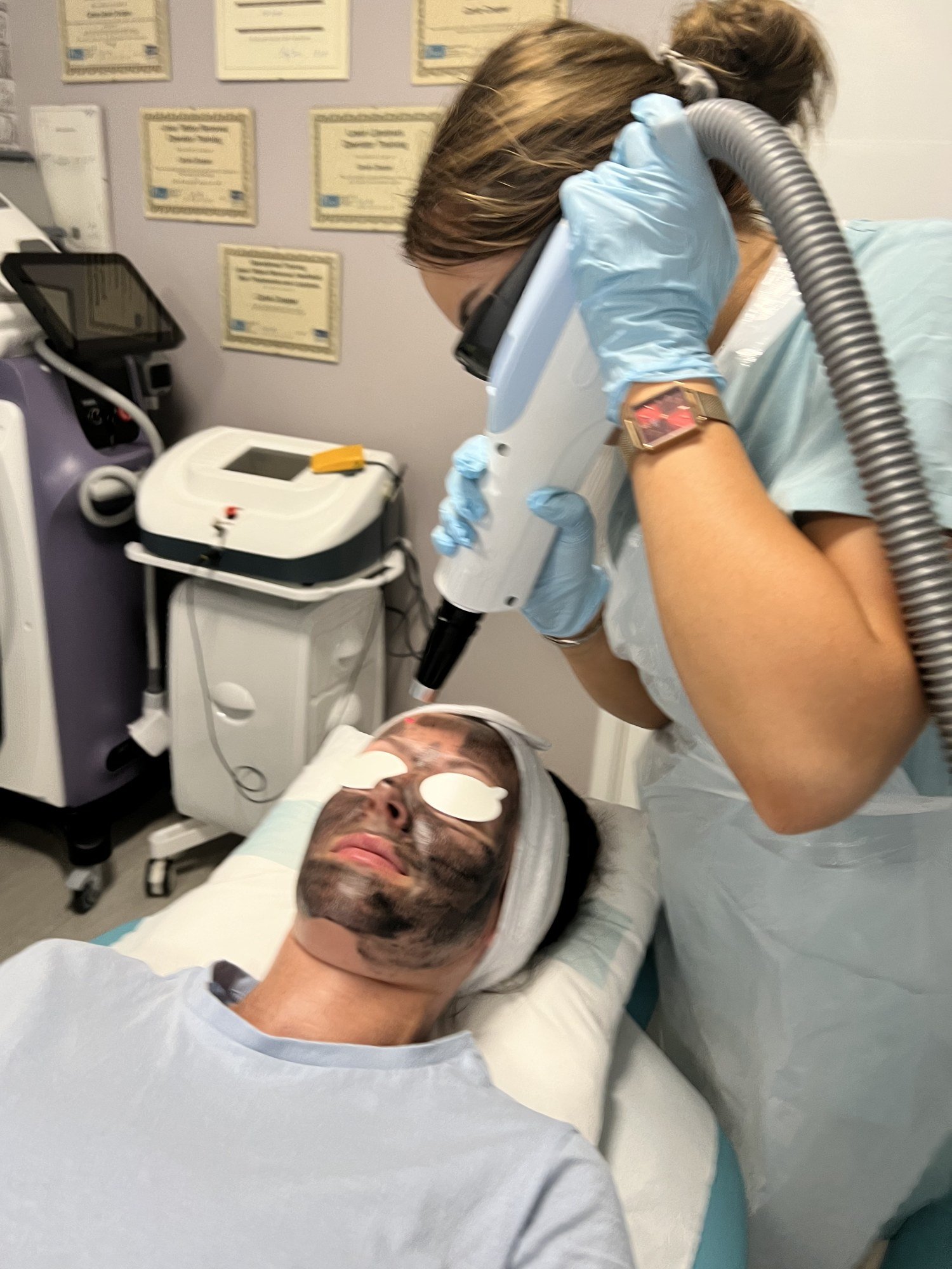 Two students carrying out supervised practical laser training at the Southampton academy