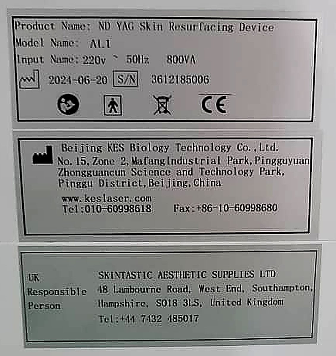 The rear rating plates on an aesthetic laser showing product name, model, serial number, CE mark, manufacturer address and UK Responsible Person