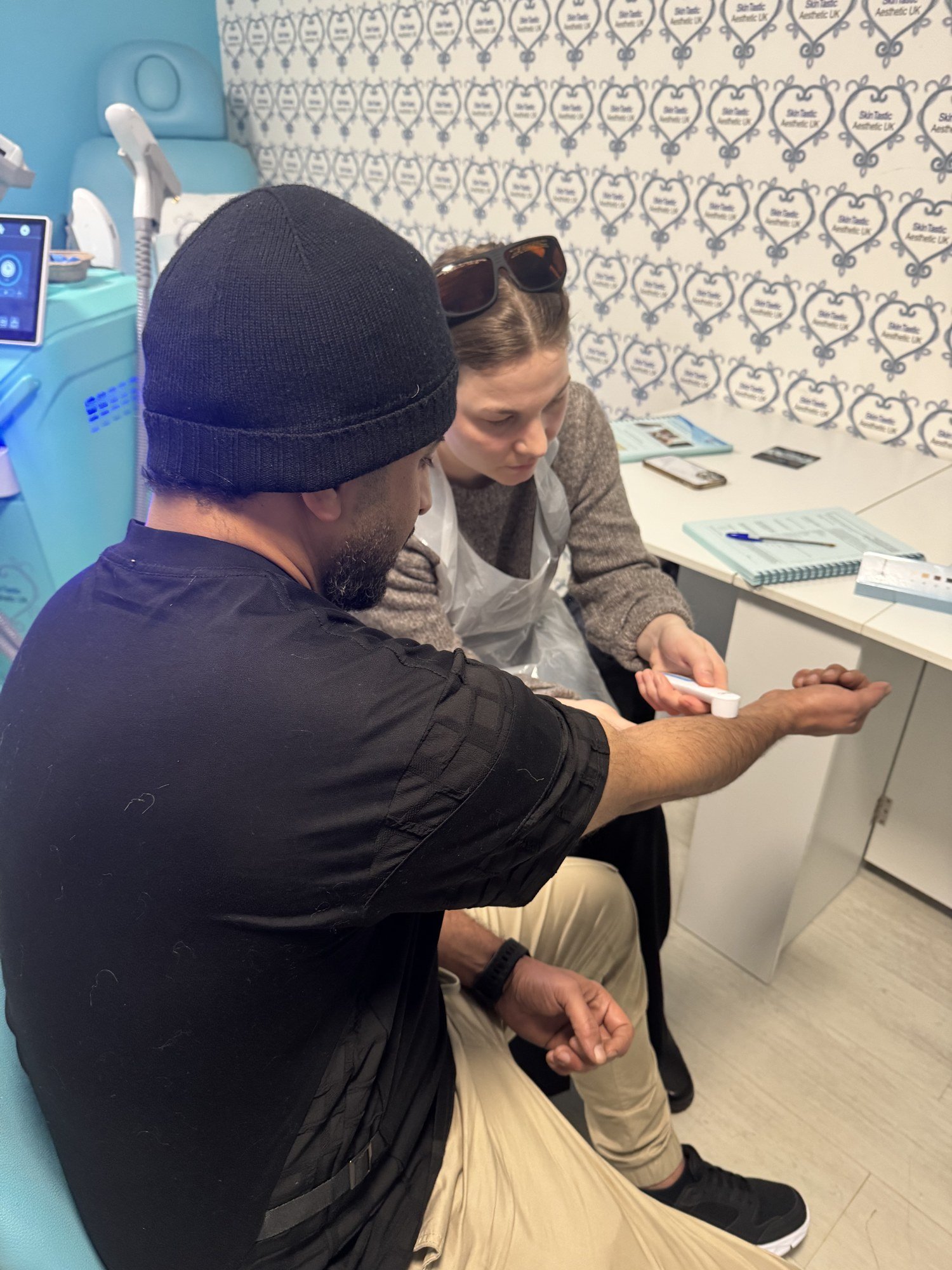 Practical laser training at the Skintastic academy in Southampton, with a learner observing
