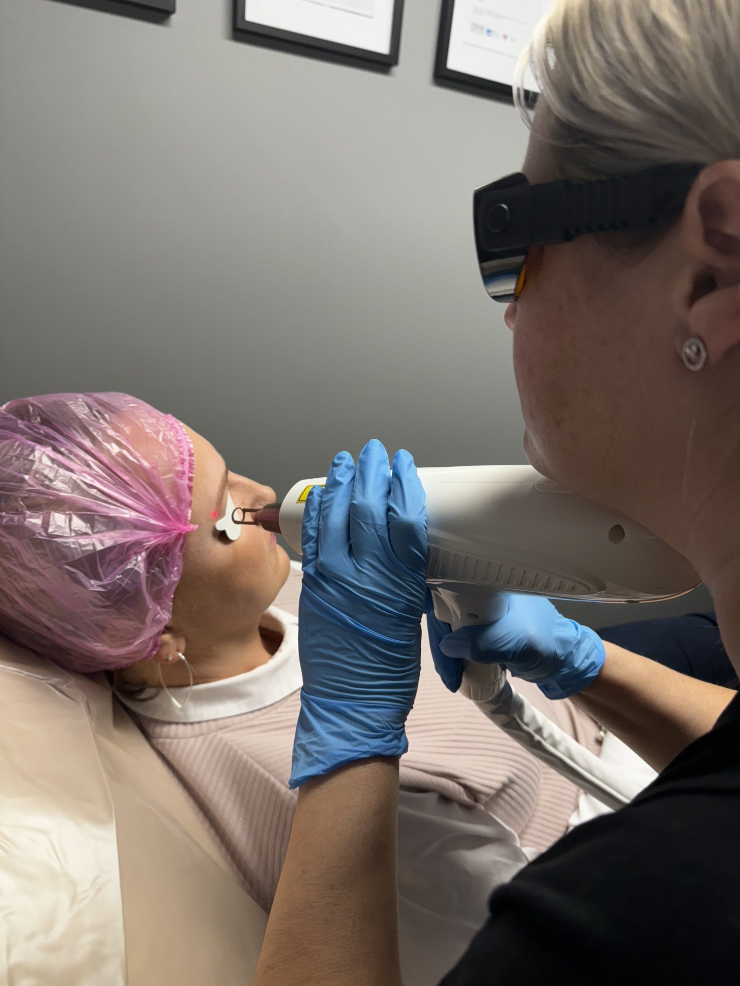 Practitioner treating a client during training at the Skintastic academy