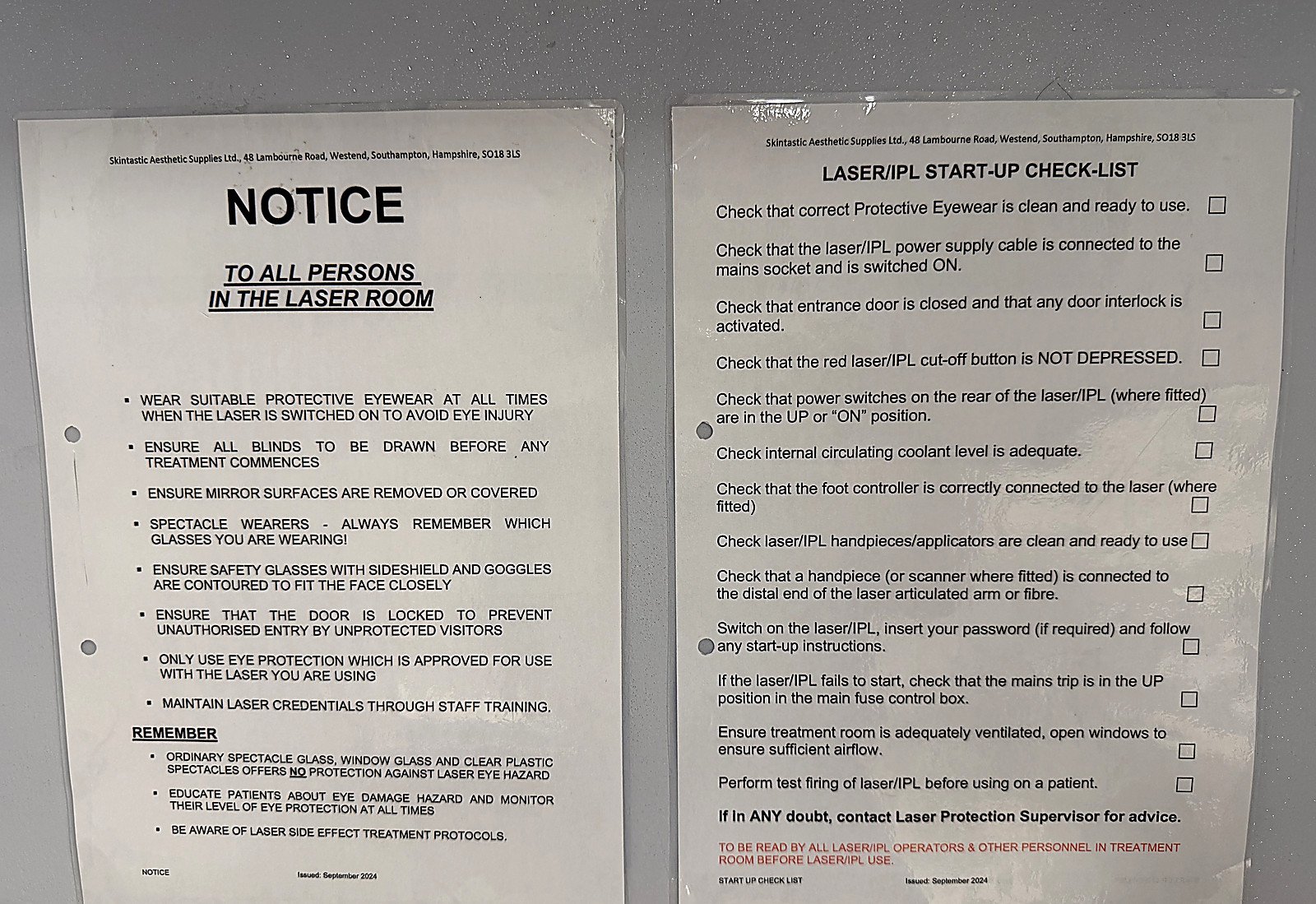 A laser room notice and a laser and IPL start-up checklist displayed on the treatment room wall