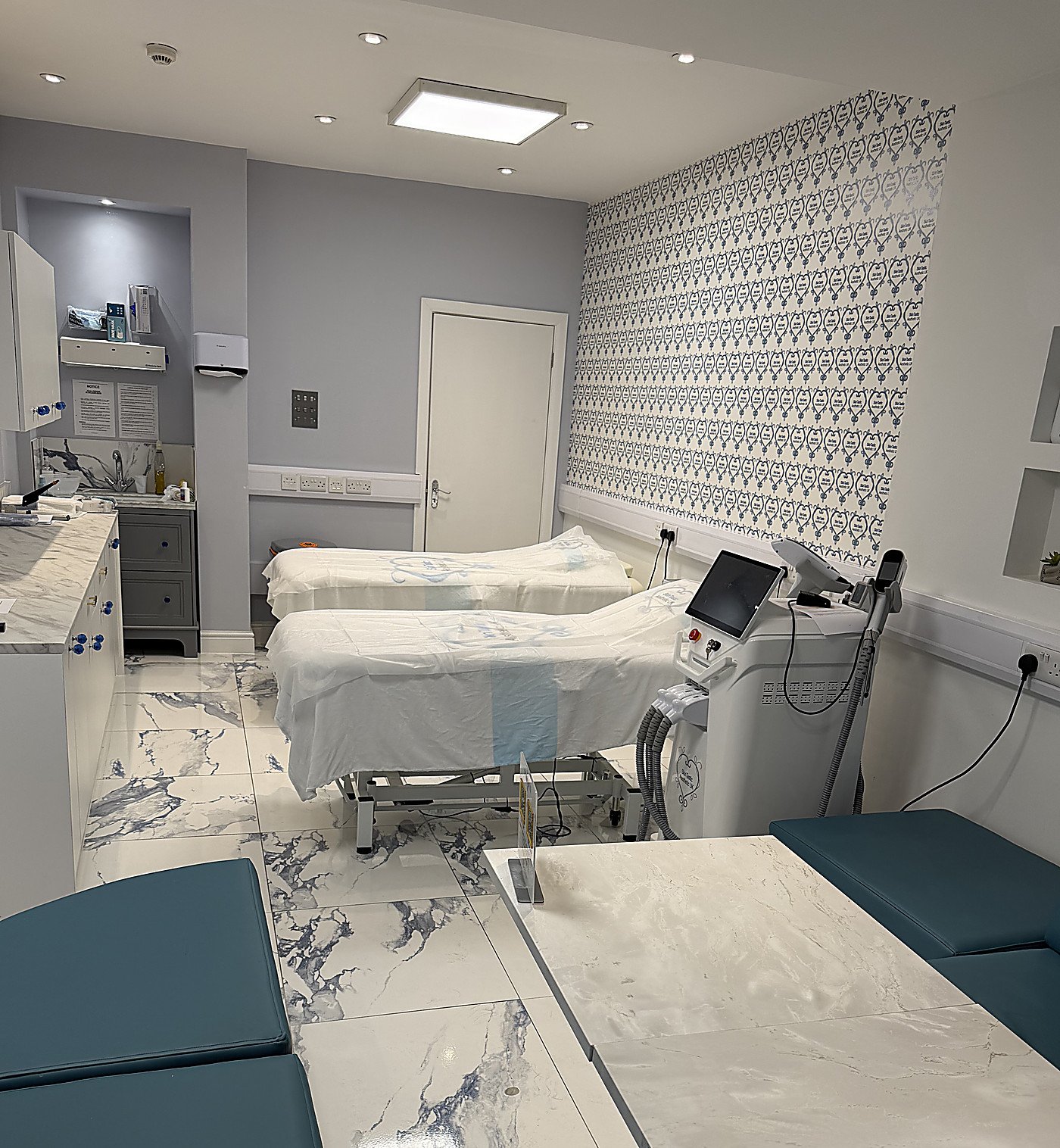 The Skintastic laser treatment room, showing a single controlled entrance door, no mirrors and no reflective surfaces near the working area