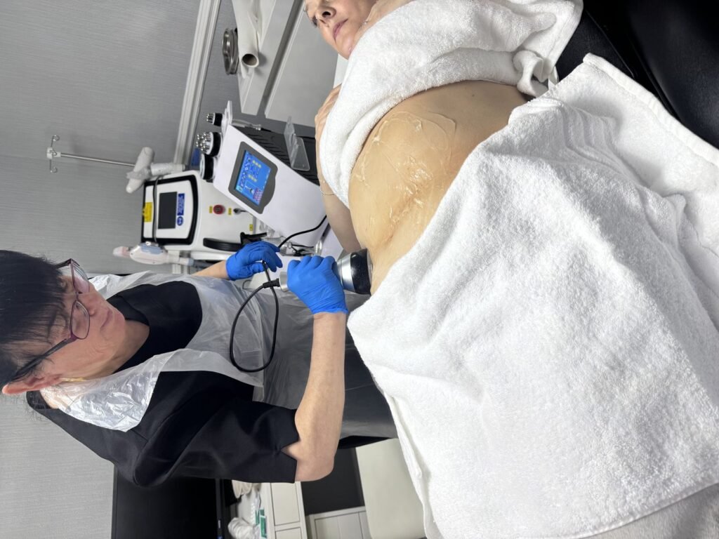 Ultrasound cavitation Level 4 training treatment being demonstrated on a client's back