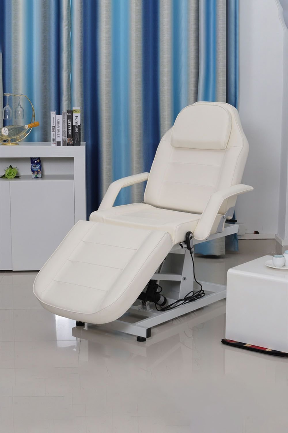 White electric facial bed with motorised height adjustment and reclining backrest