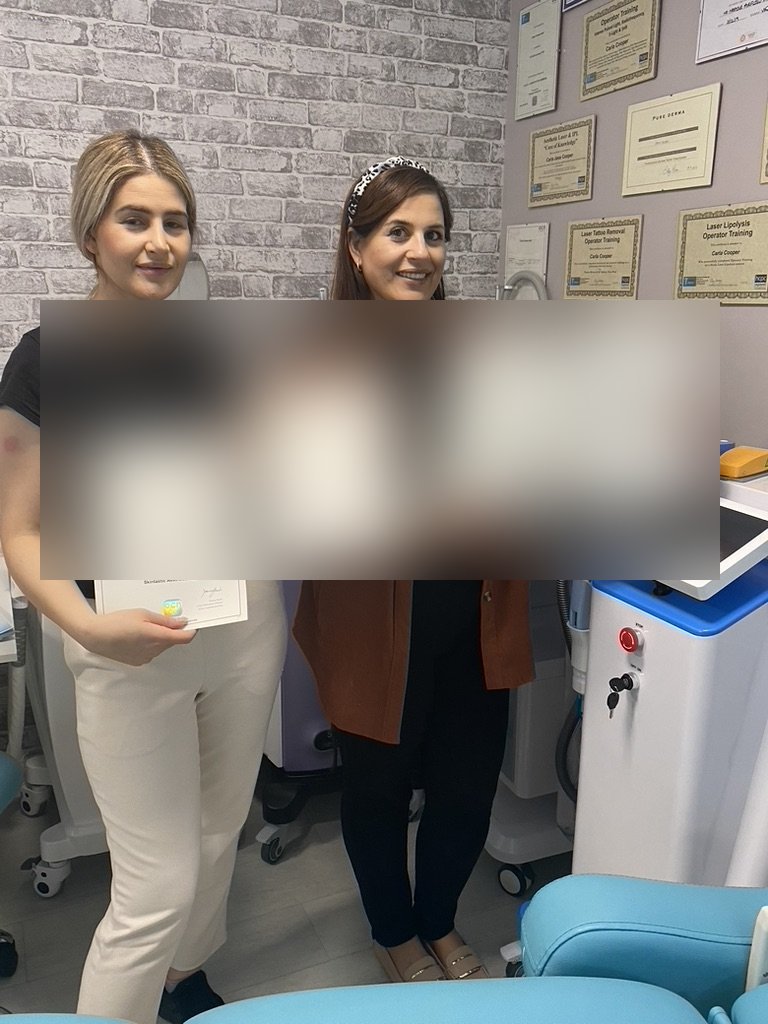 Graduate students holding OCN qualification certificates at Skintastic Aesthetics training academy