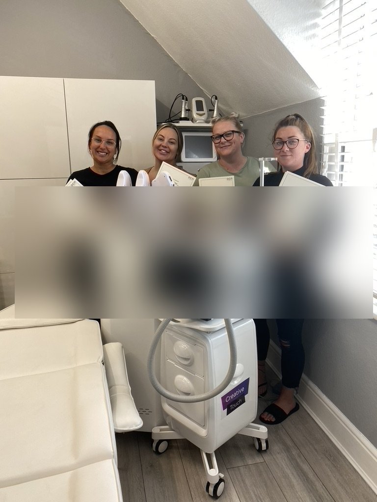 Graduate students holding OCN qualification certificates at Skintastic Aesthetics training academy