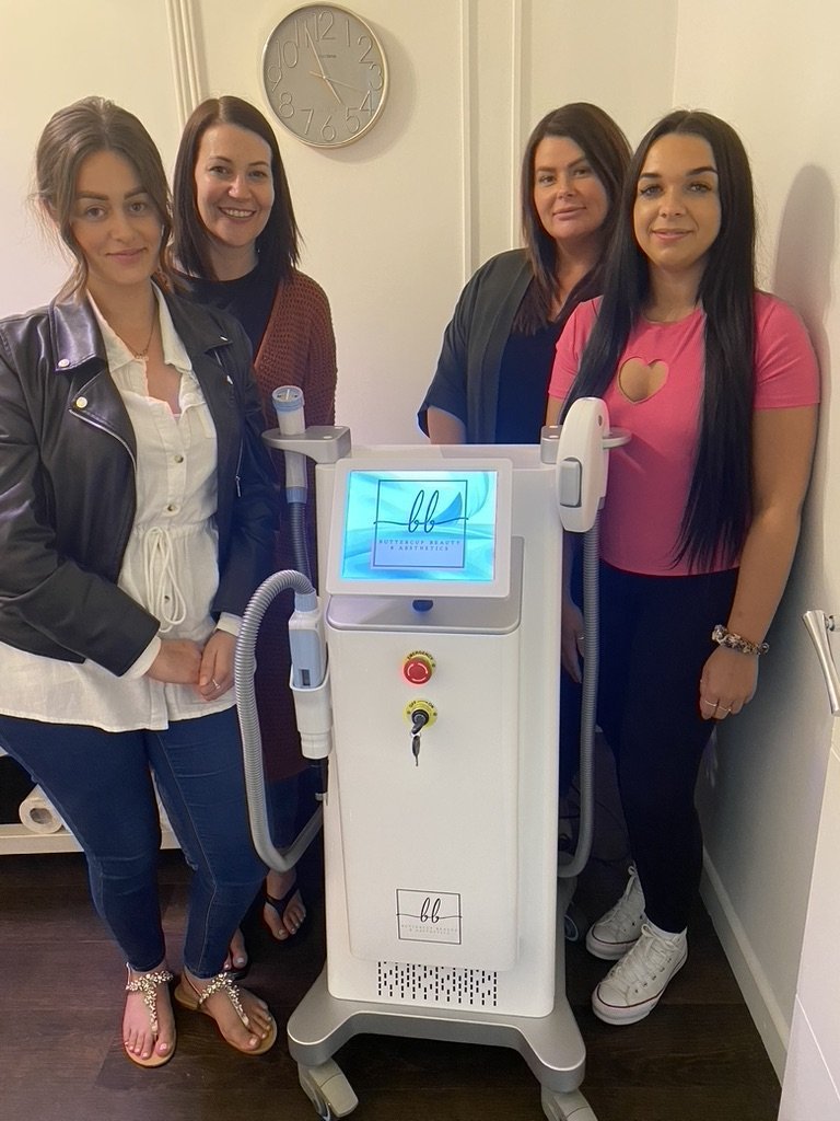 Graduate students at Skintastic Aesthetics training academy with laser equipment